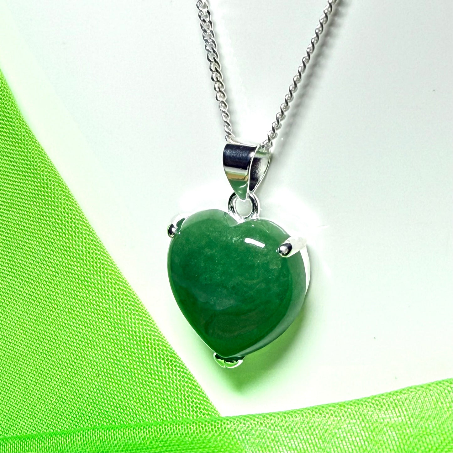 A real light green jade necklace heart shape sterling silver with solid chain