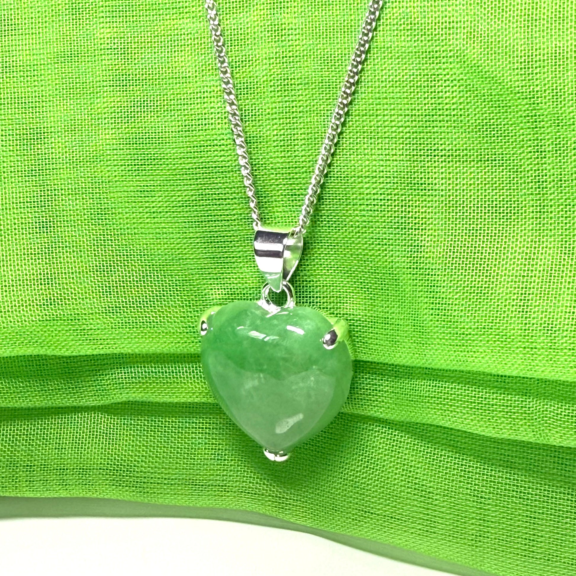 A real light green jade necklace heart shape sterling silver pendant