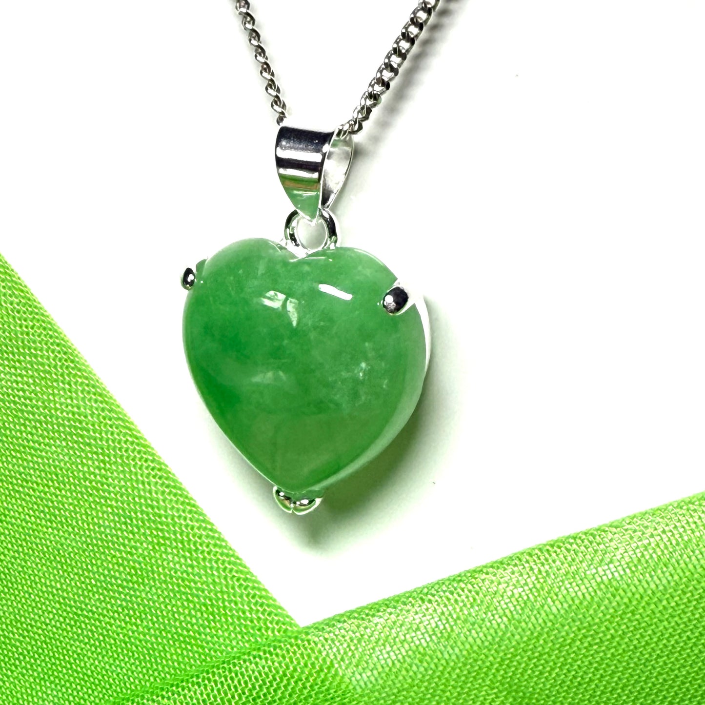 A real light green jade necklace heart shape sterling silver pendant