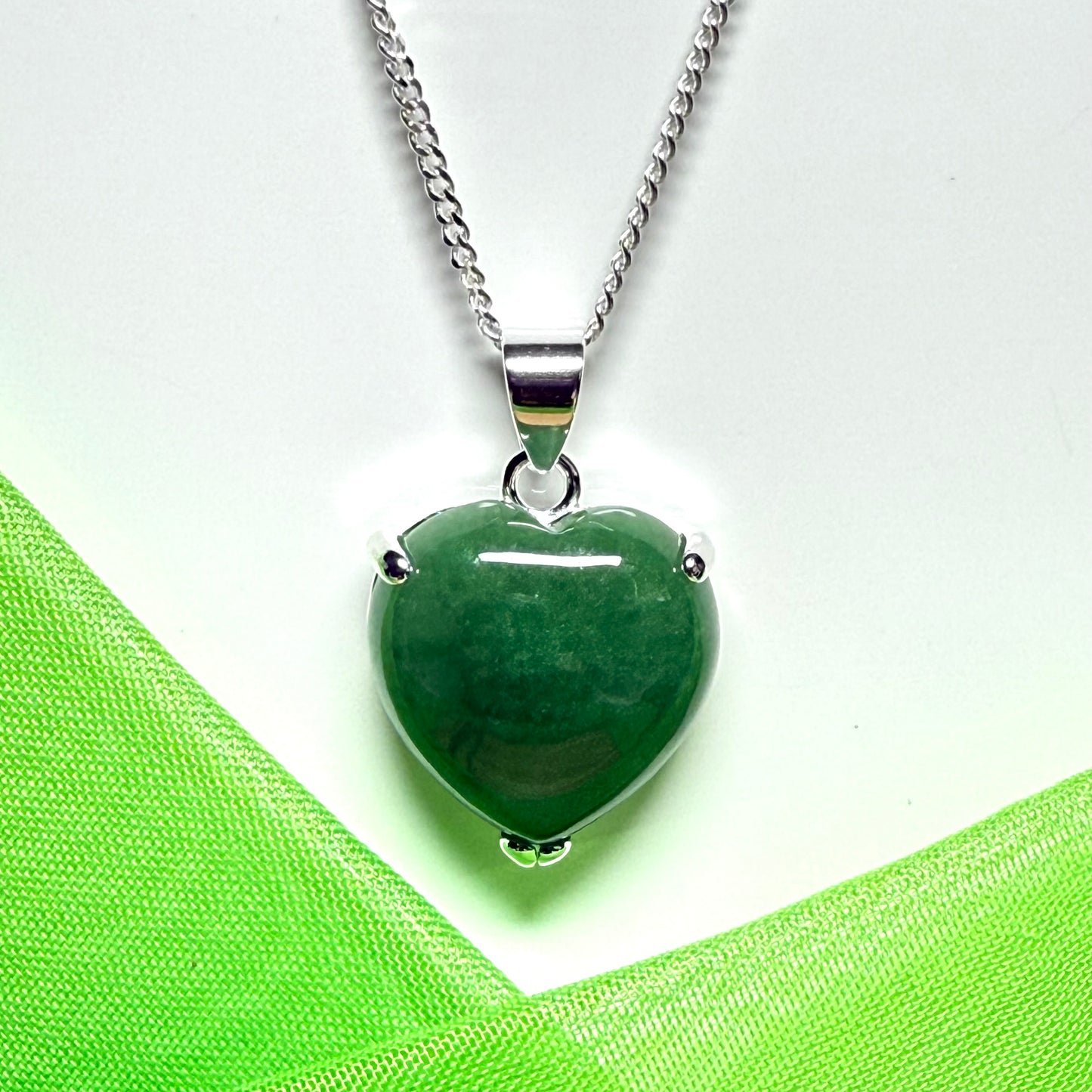 A real light green jade necklace heart shape sterling silver with solid chain