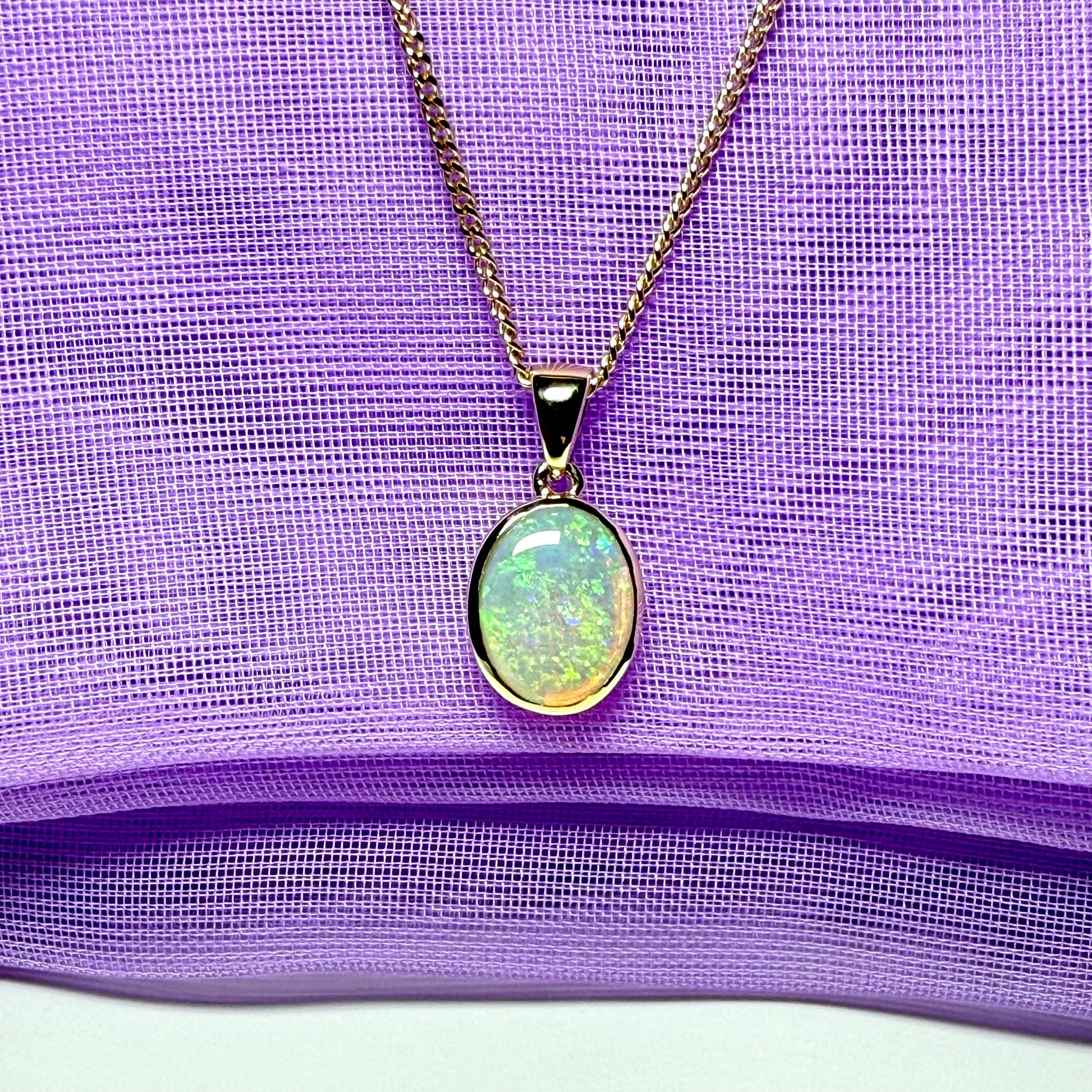 Real opal necklace yellow gold oval pendant smooth rubbed over setting