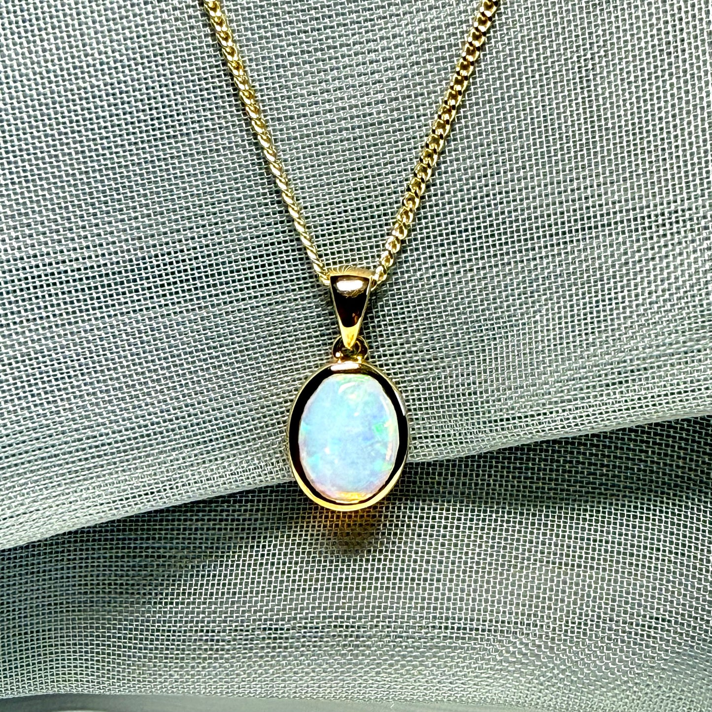 Real opal necklace yellow gold oval pendant smooth rubbed over smooth setting