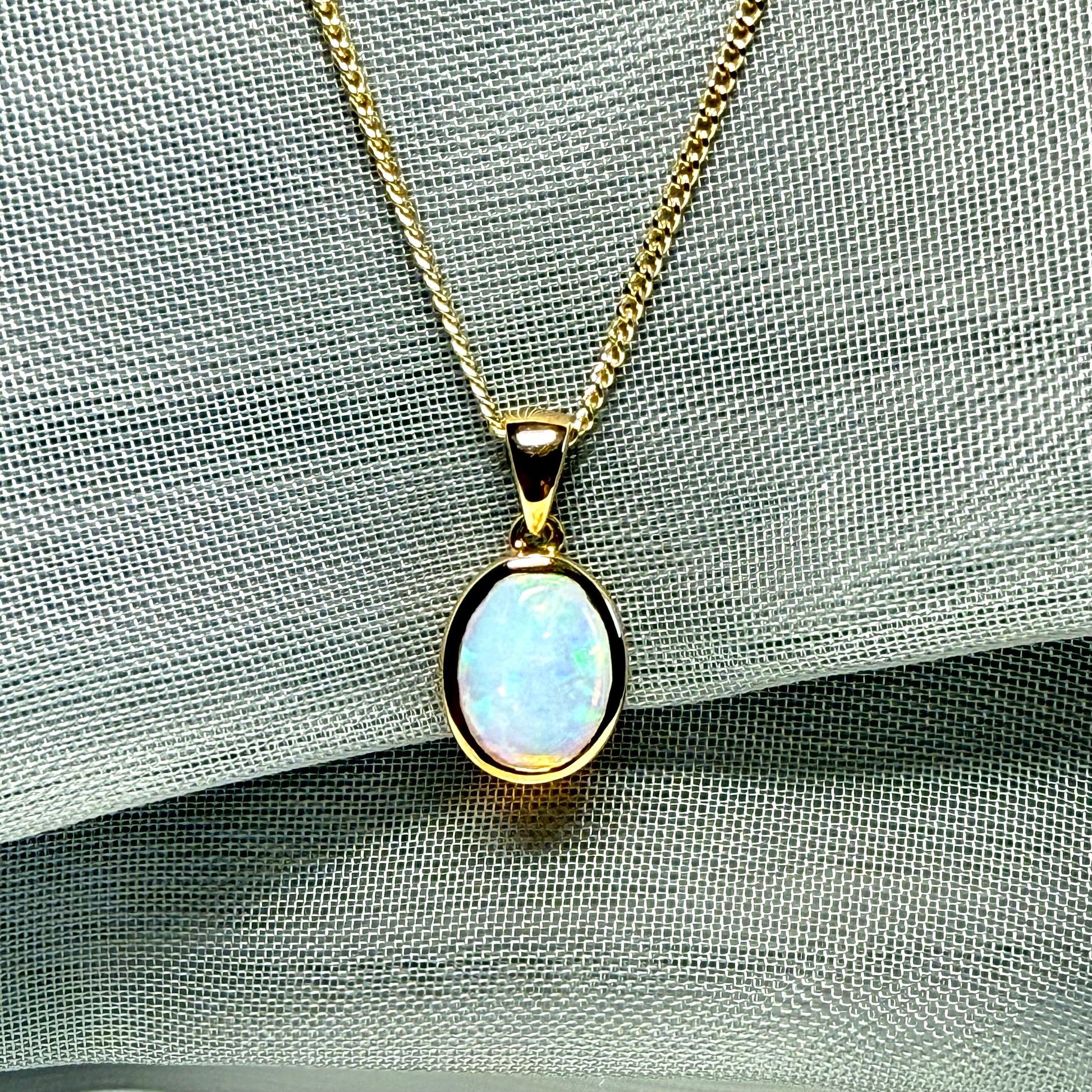 Real opal necklace yellow gold oval pendant smooth rubbed over smooth setting