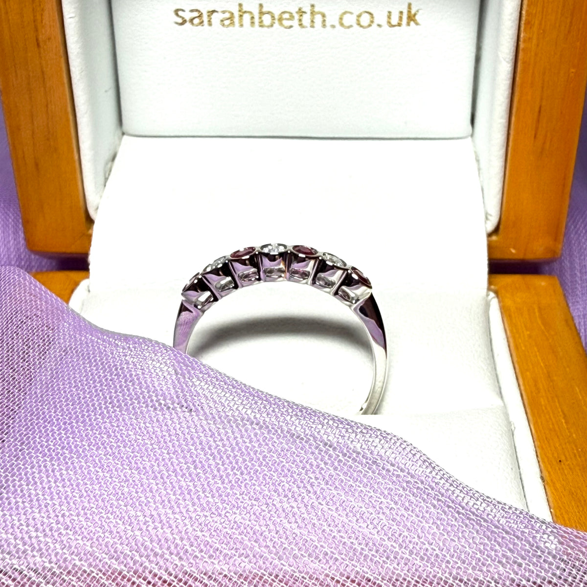 A real ruby and diamond white gold eternity ring smooth rub over setting