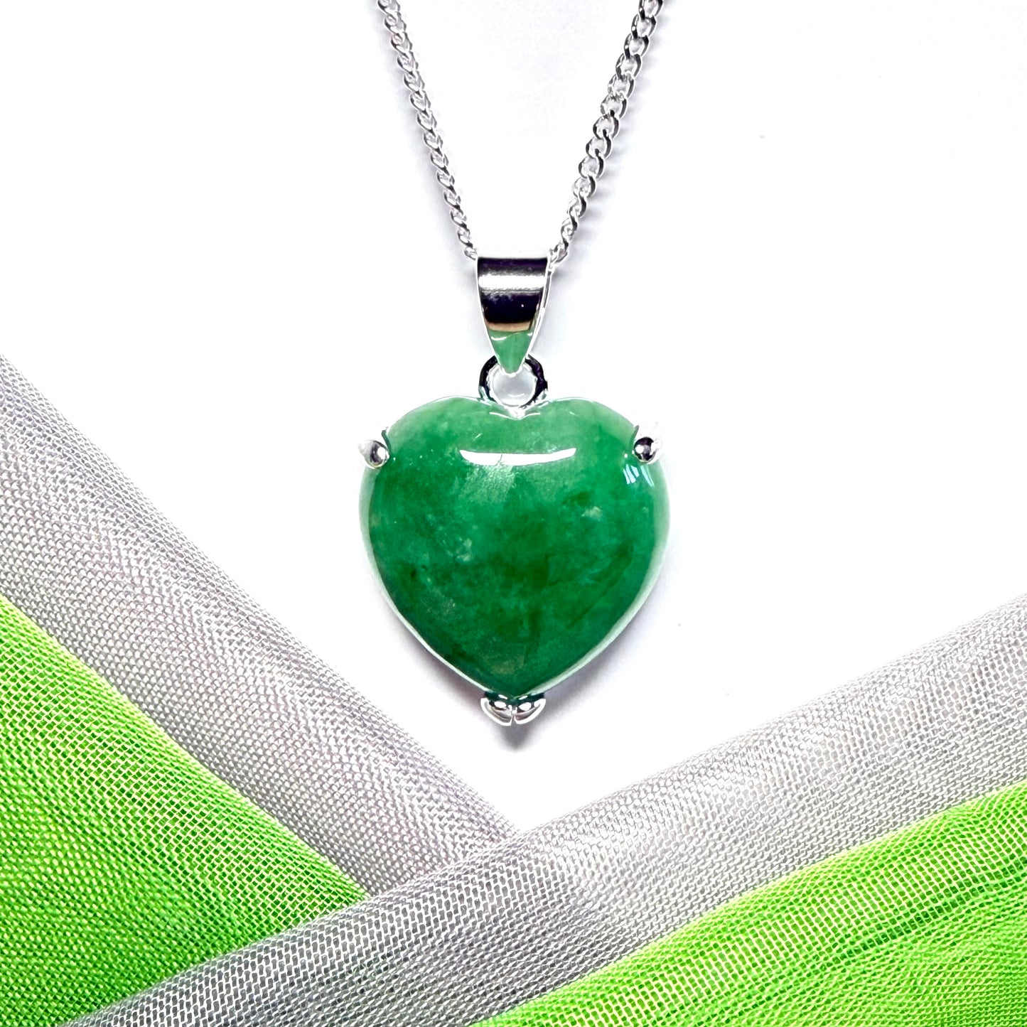 A really beautiful pendant real green jade necklace heart shaped sterling silver with a solid chain