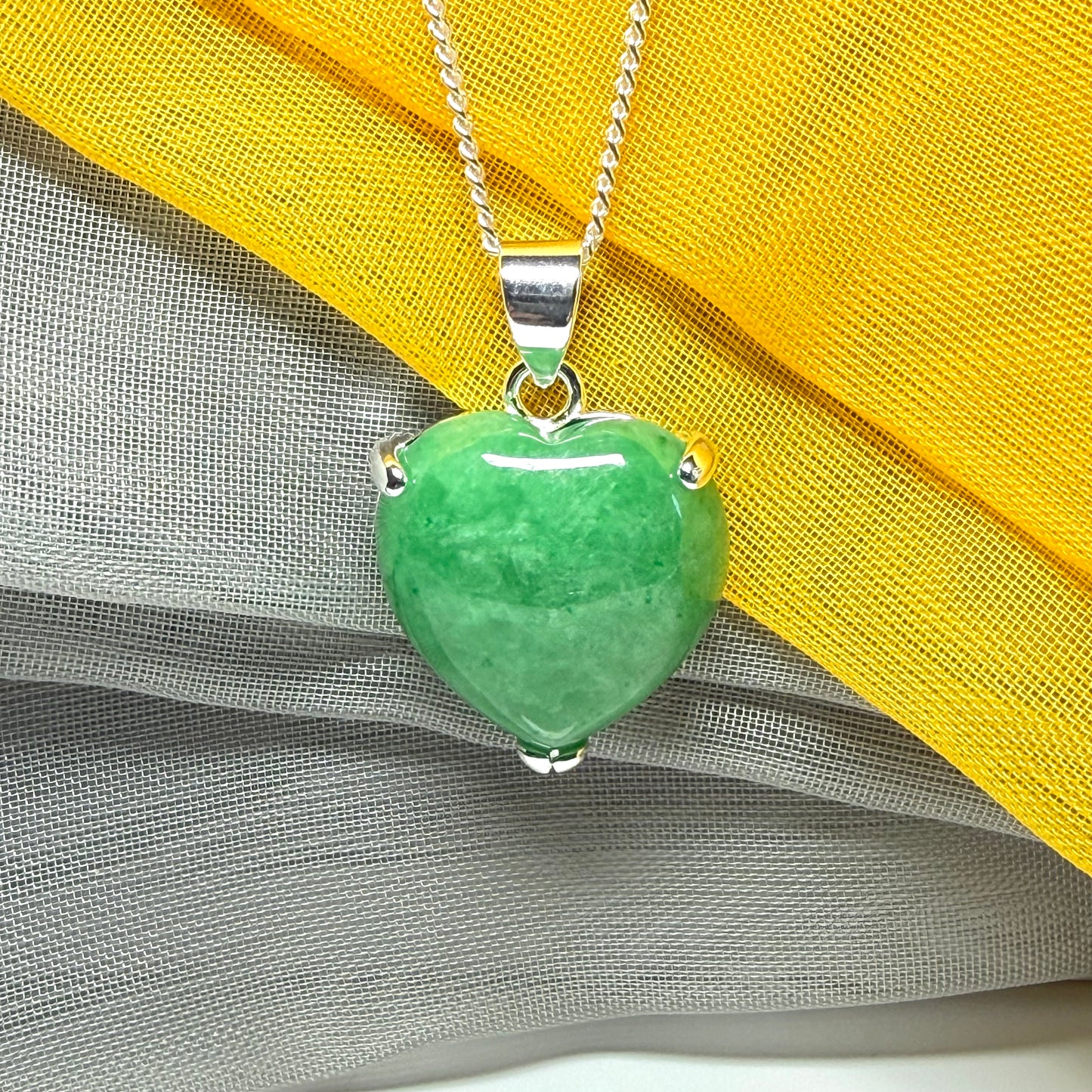 A really beautiful real green jade necklace heart shaped sterling silver, a gorgeous pendant