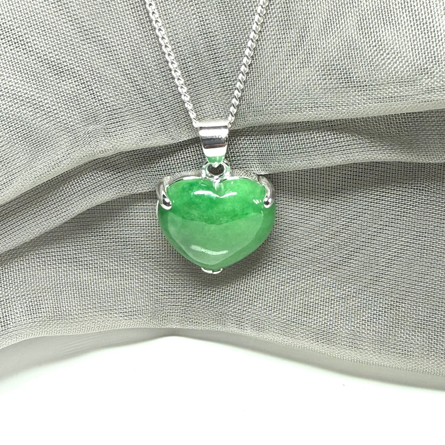 A really beautiful real green jade necklace heart shaped sterling silver, a stunning pendant