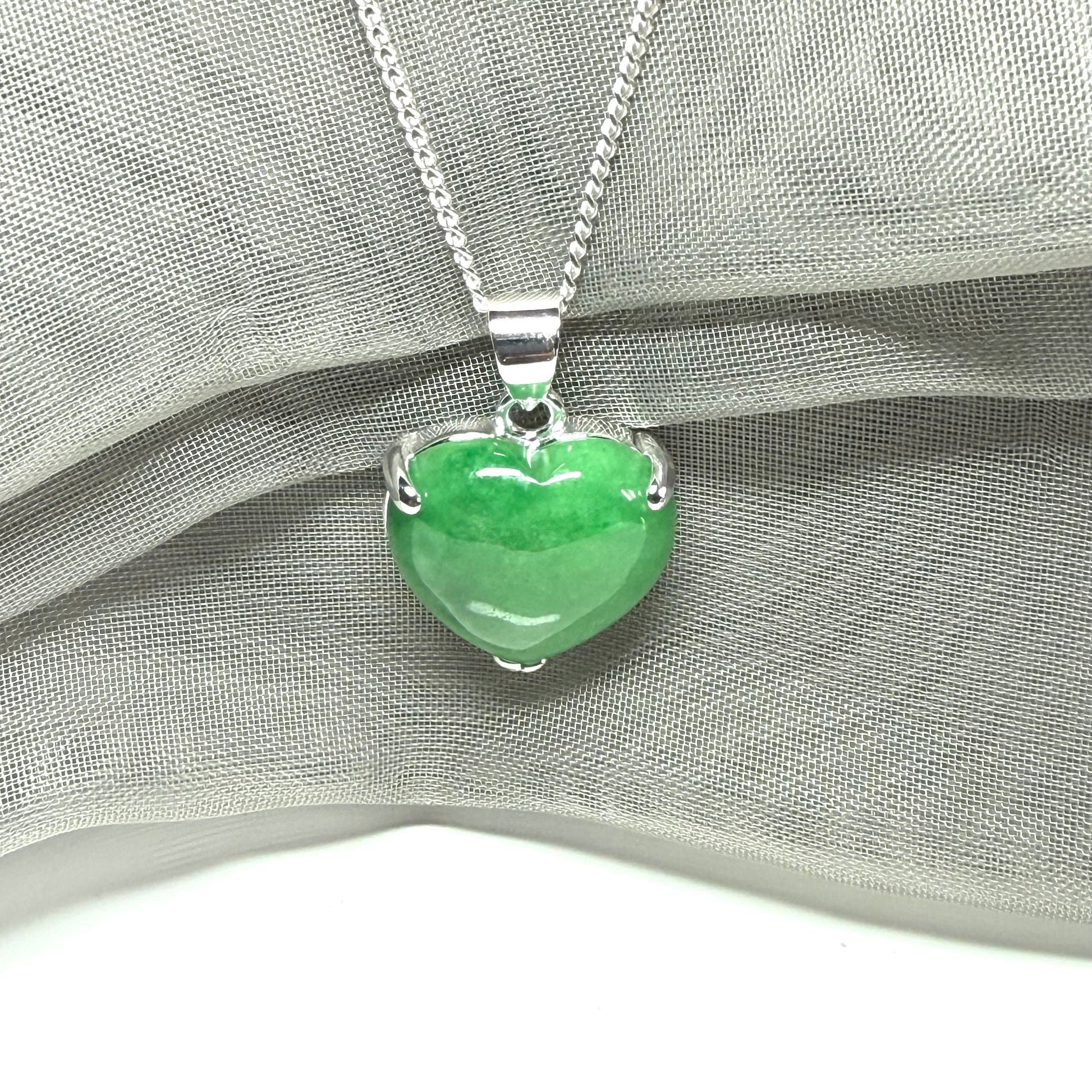 A really beautiful real green jade necklace heart shaped sterling silver, a stunning pendant