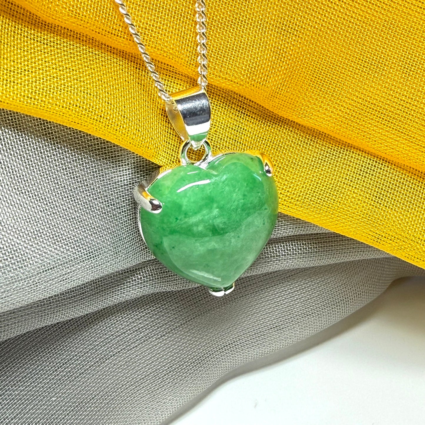 A really beautiful real green jade necklace heart shaped sterling silver, a gorgeous pendant