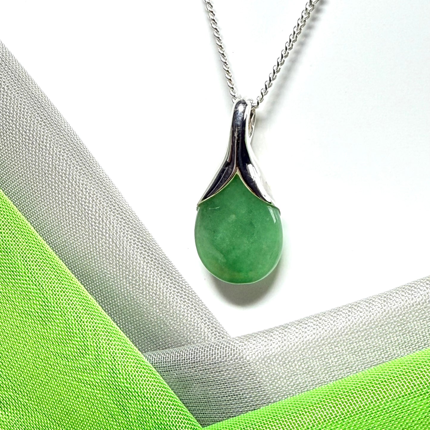 A really stunning real green jade necklace in a teardrop, a timeless design