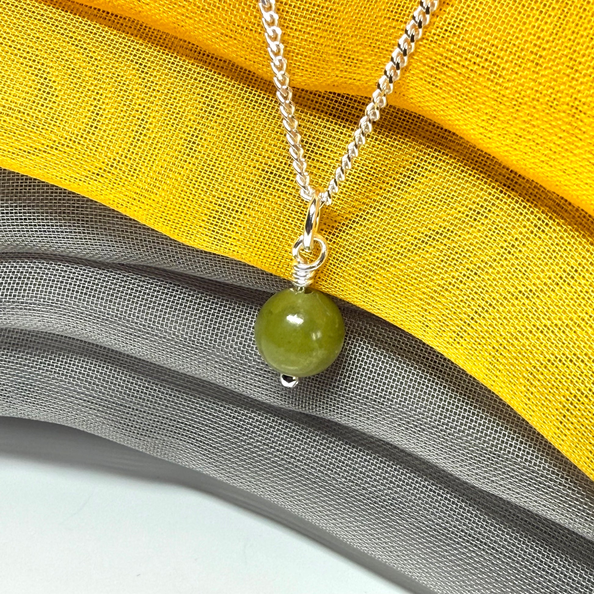 A really gorgeous small real green gypsum necklace ball shaped, a really gorgeous round pendant with chain