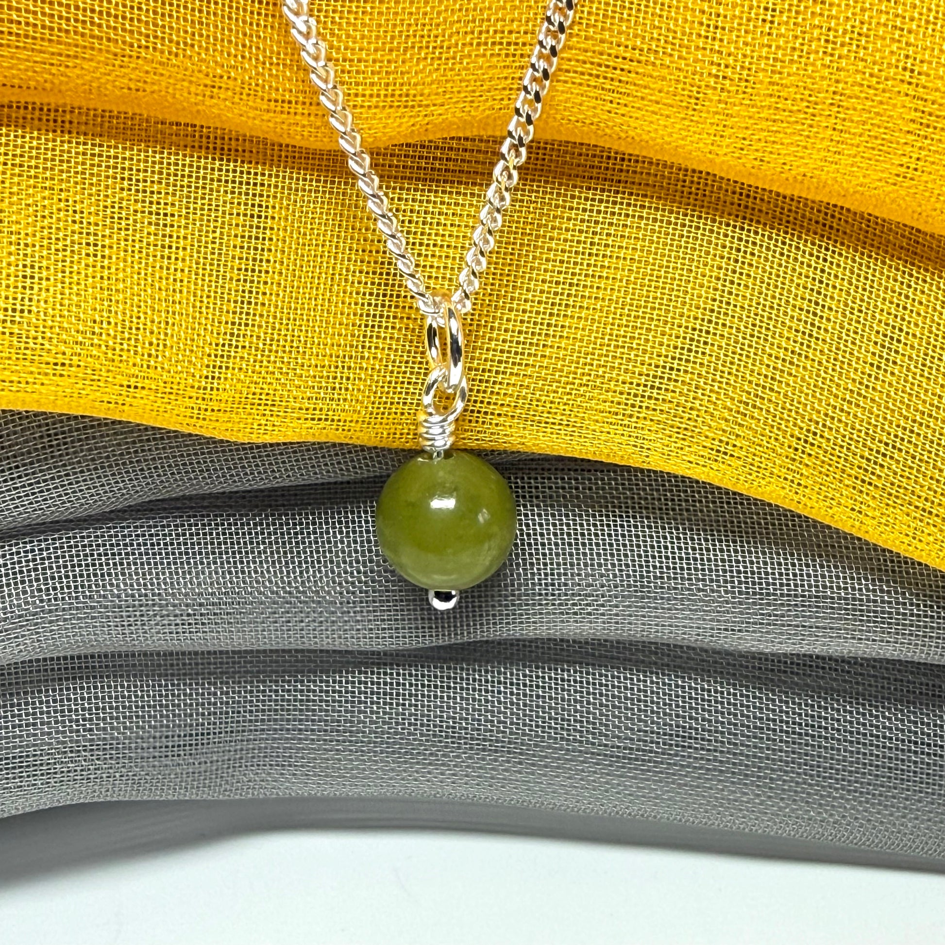 A really gorgeous small real green gypsum necklace ball shaped, a really gorgeous round pendant with chain
