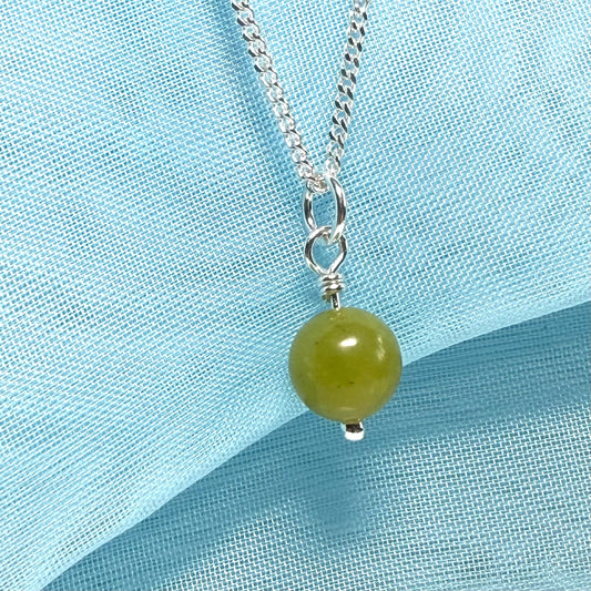 A really gorgeous small real green gypsum necklace ball shaped, a really gorgeous round pendant with chain included