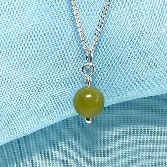 A really gorgeous small real green gypsum necklace ball shaped, a really gorgeous round pendant with chain included