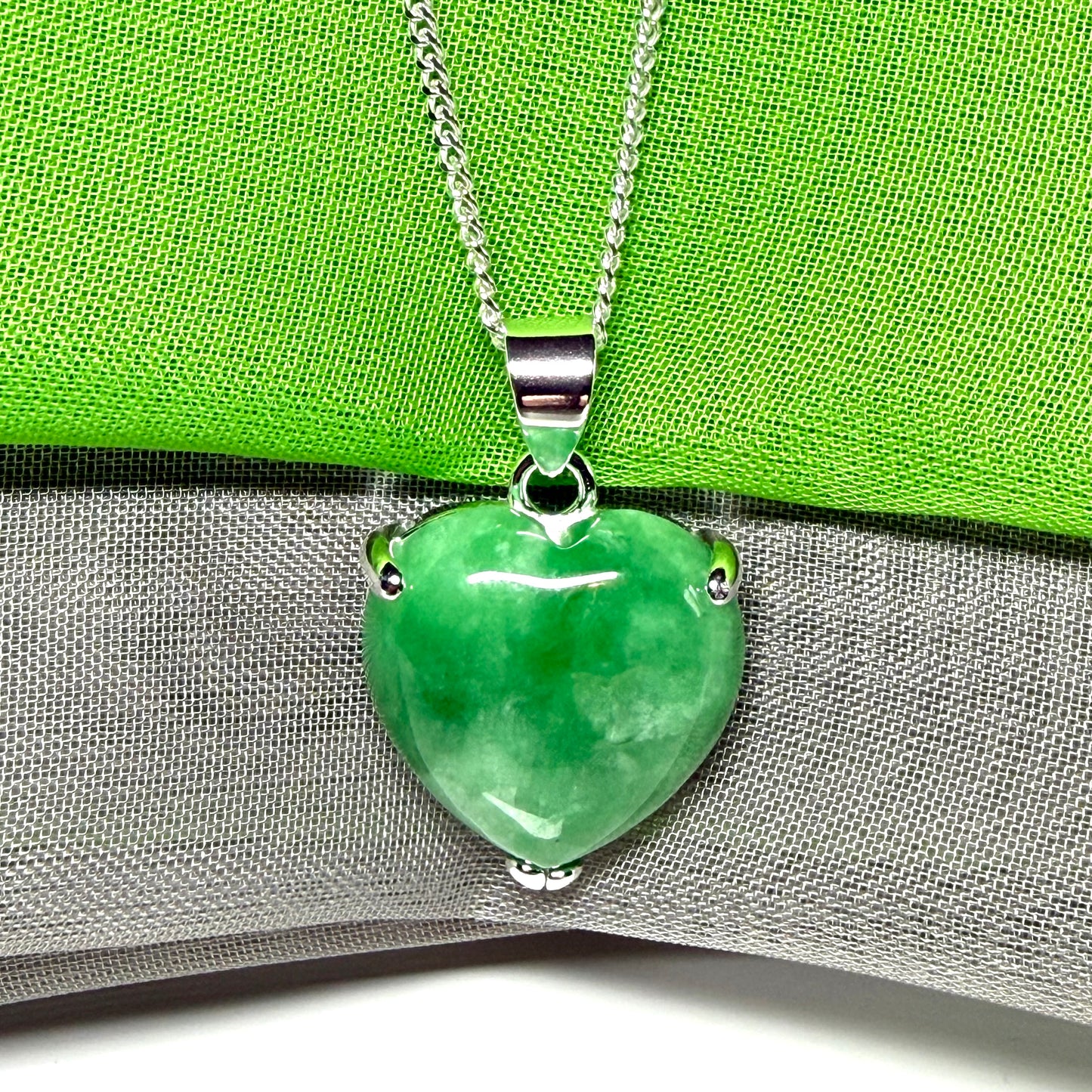A really stunning pendant with a real green jade necklace heart shaped sterling silver
