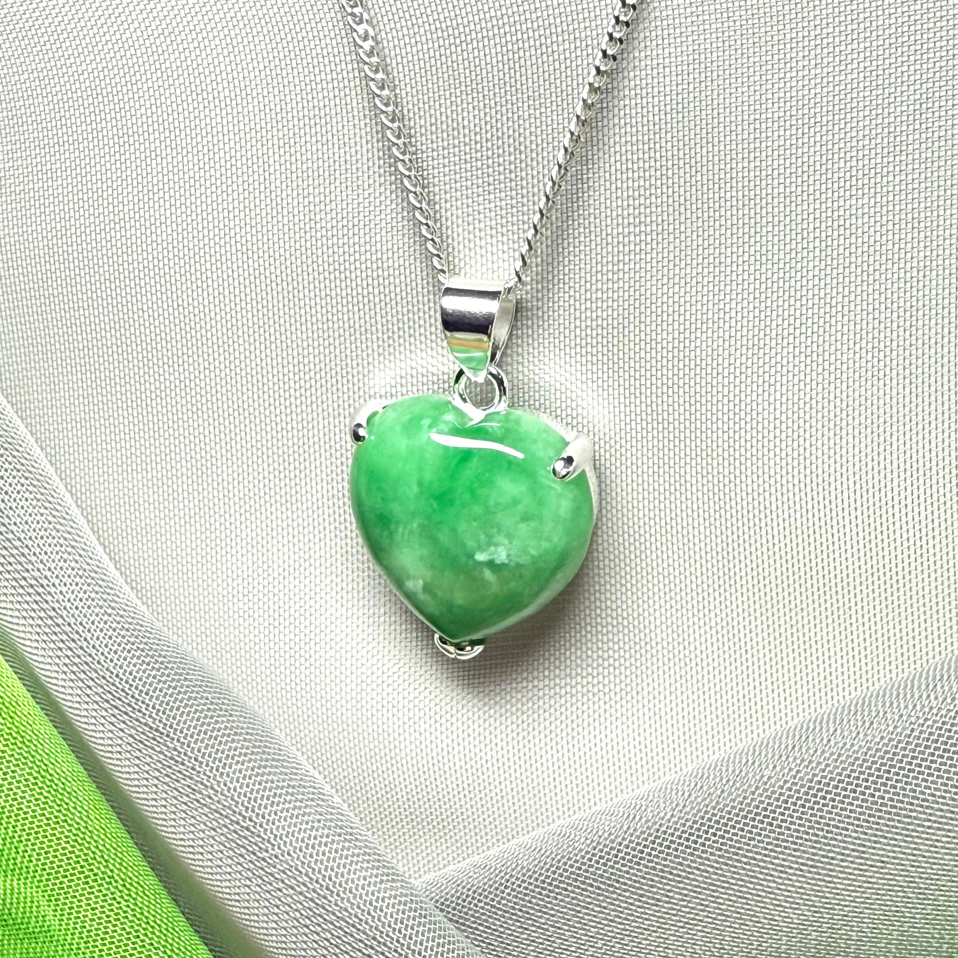 A really stunning pendant with a real green jade necklace heart shaped sterling silver
