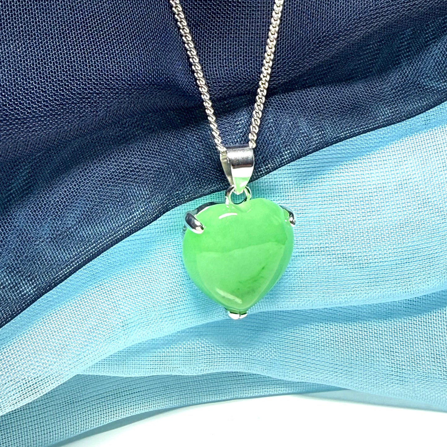A really stunning real green jade necklace heart shaped sterling silver with chain included as well
