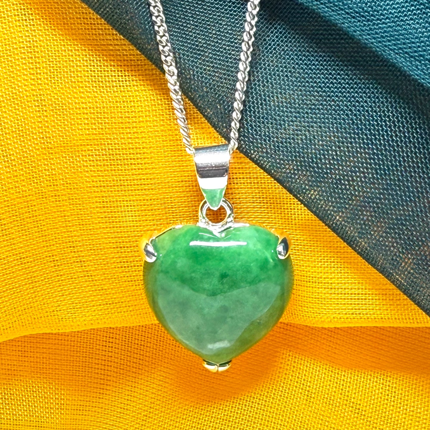 A really stunning real green jade necklace heart shaped sterling silver with a curb chain included as well