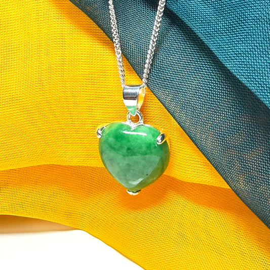 A really stunning real green jade necklace heart shaped sterling silver with a curb chain included as well