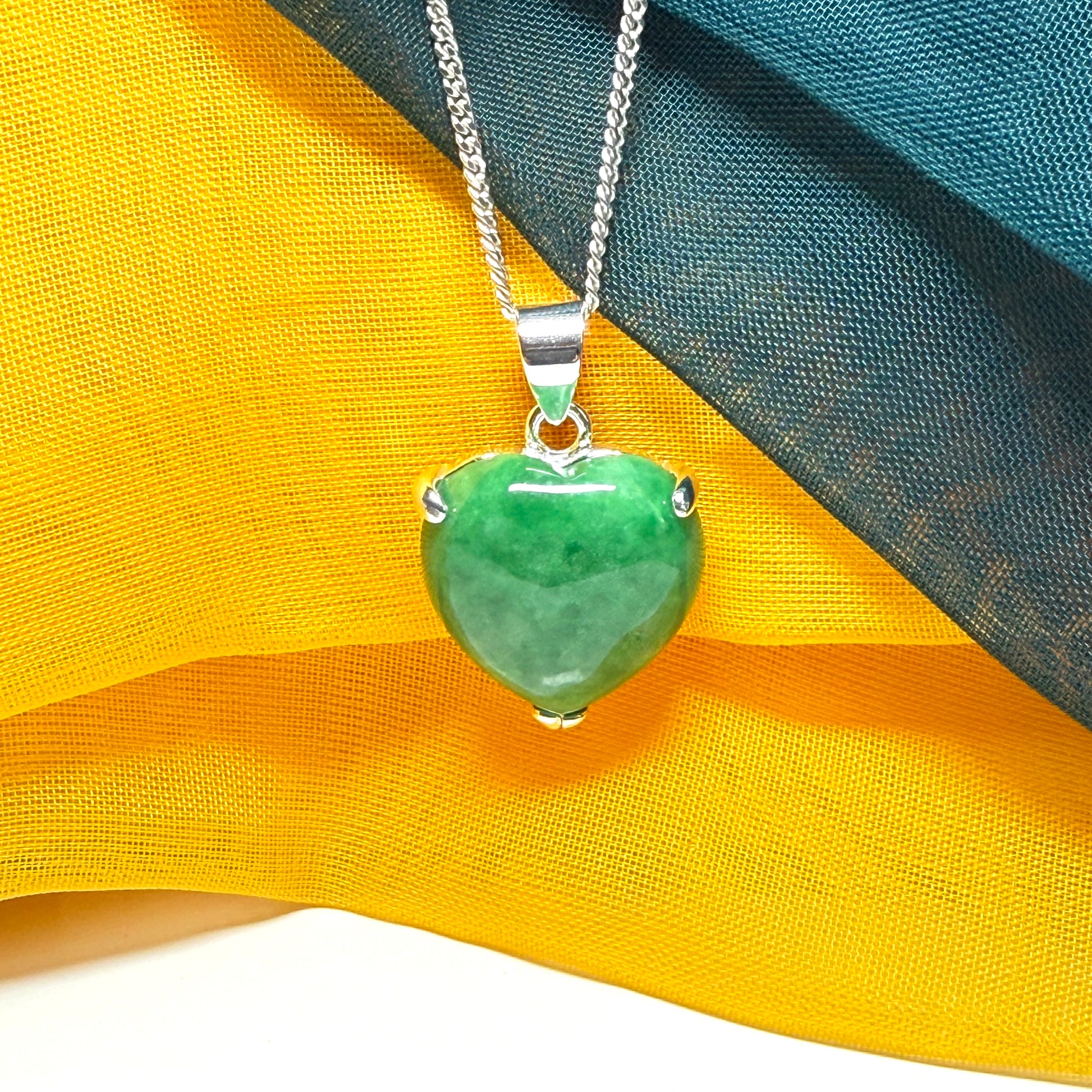 A really stunning real green jade necklace heart shaped sterling silver with a curb chain included as well