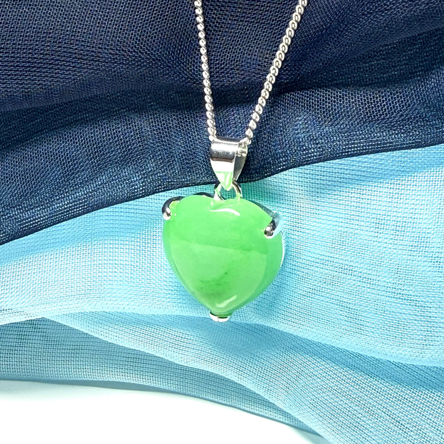 A really stunning real green jade necklace heart shaped sterling silver with chain included as well