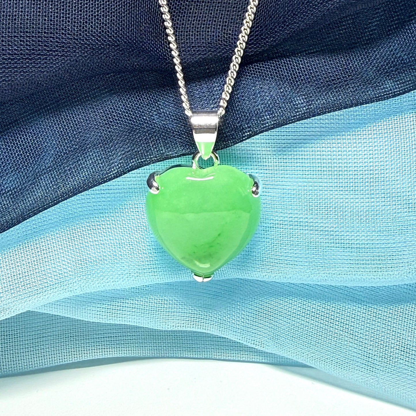 A really stunning real green jade necklace heart shaped sterling silver with chain included as well