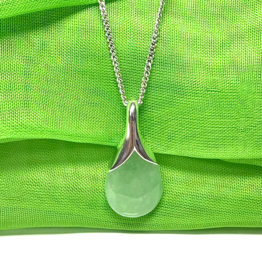 A really stunning real green jade necklace in a pear shaped design including a solid curb chain
