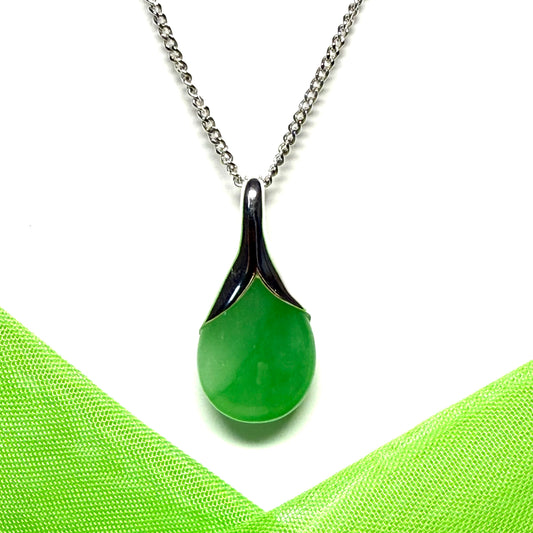 A really stunning real green jade necklace with a pear shaped design including a solid chain