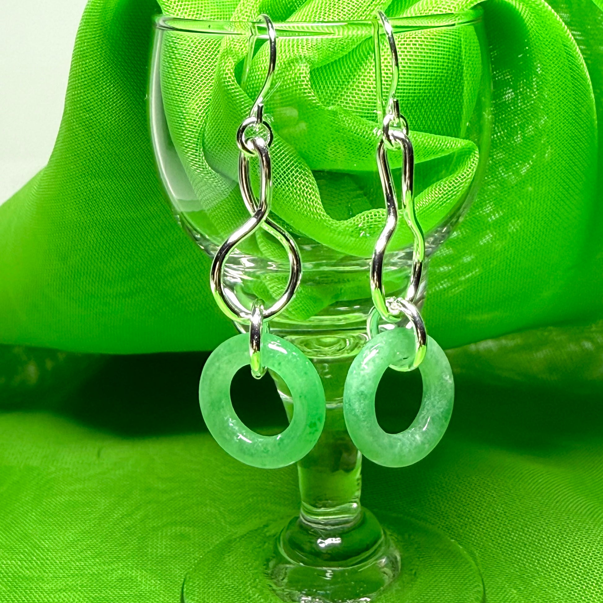 A rounded shaped real green jade sterling silver dangling dropped earrings