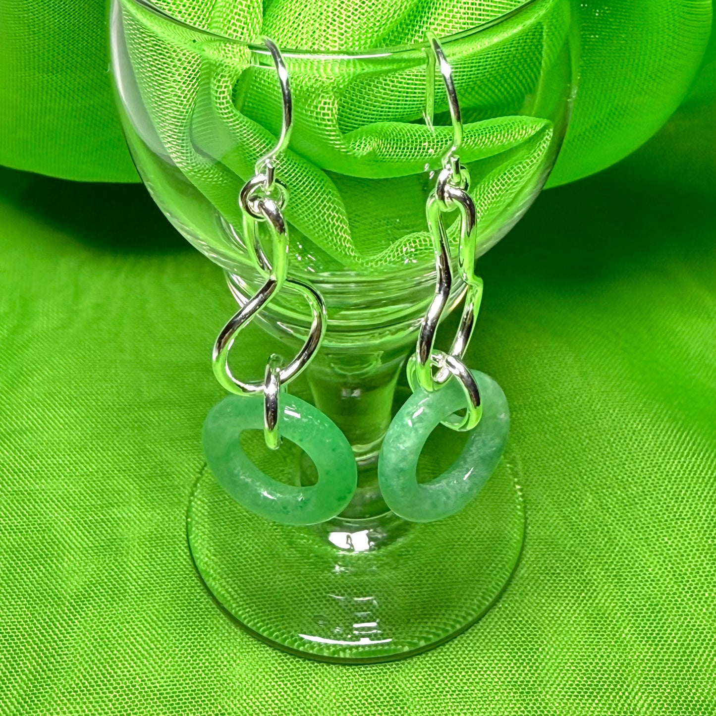 A rounded shaped real green jade sterling silver dangling dropped earrings