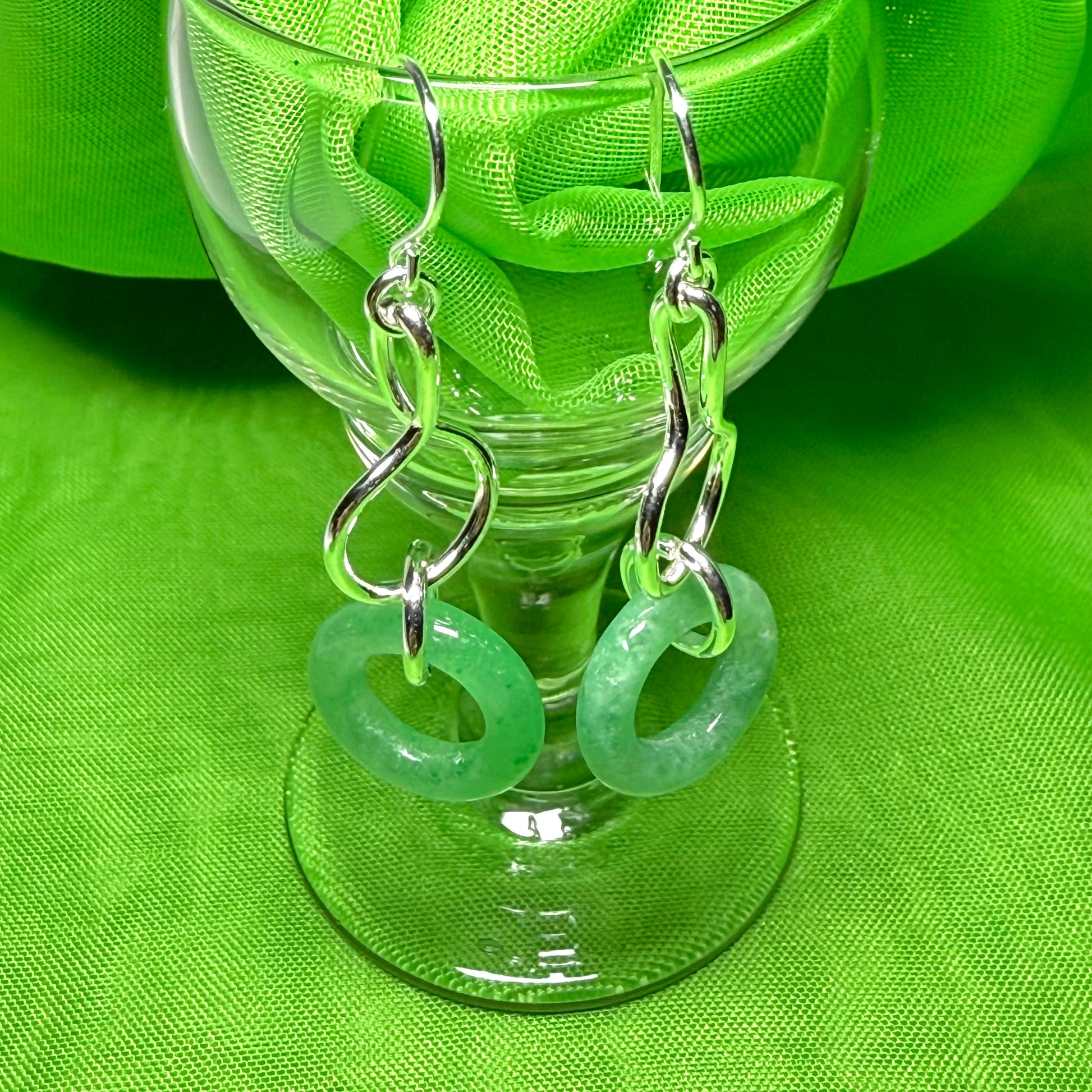 A rounded shaped real green jade sterling silver dangling dropped earrings