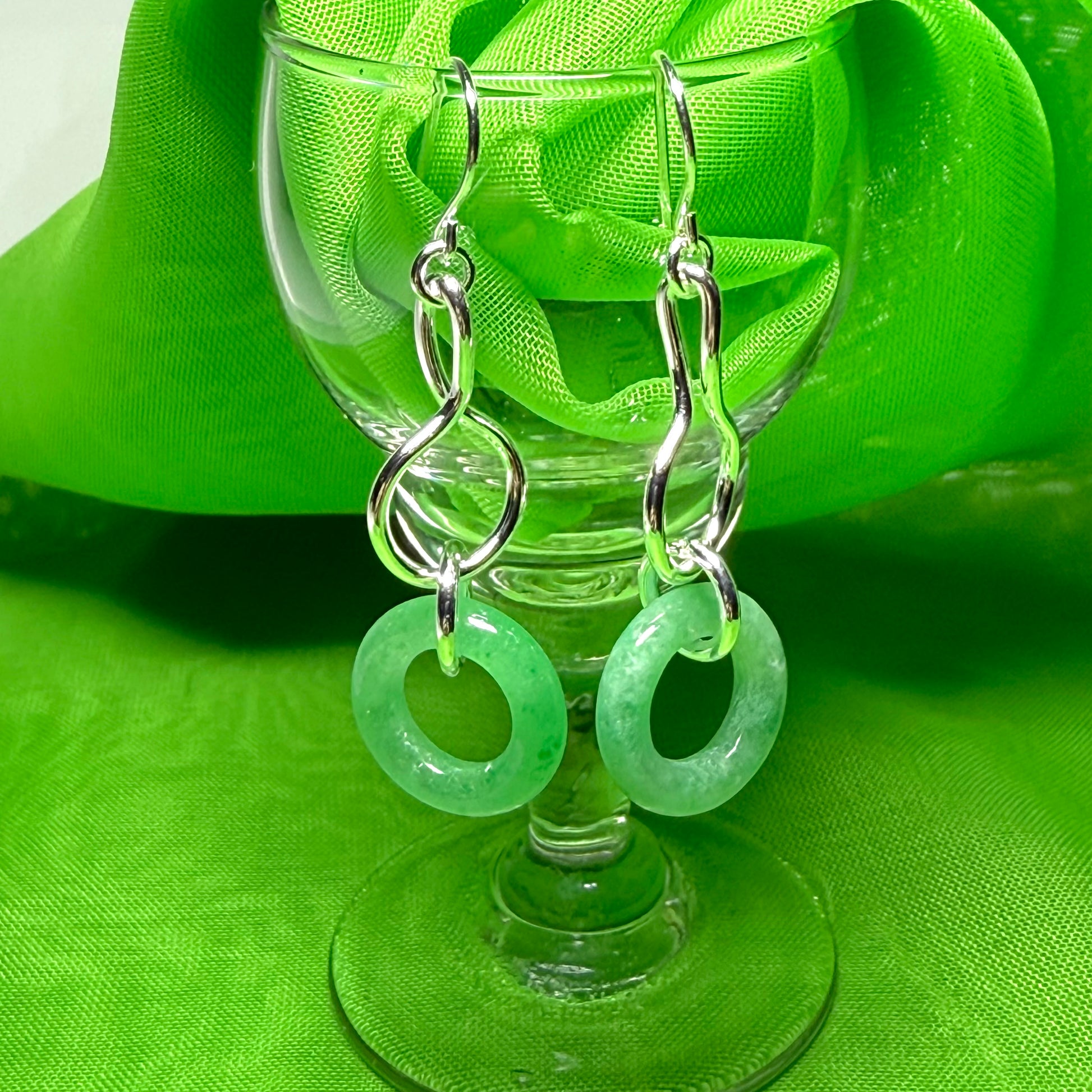 A rounded shaped real green jade sterling silver dangling dropped earrings