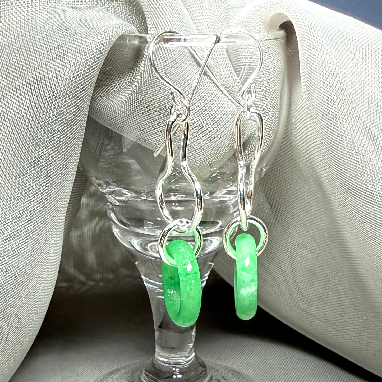 A rounded shaped real green jade sterling silver looped dangling dropped earrings