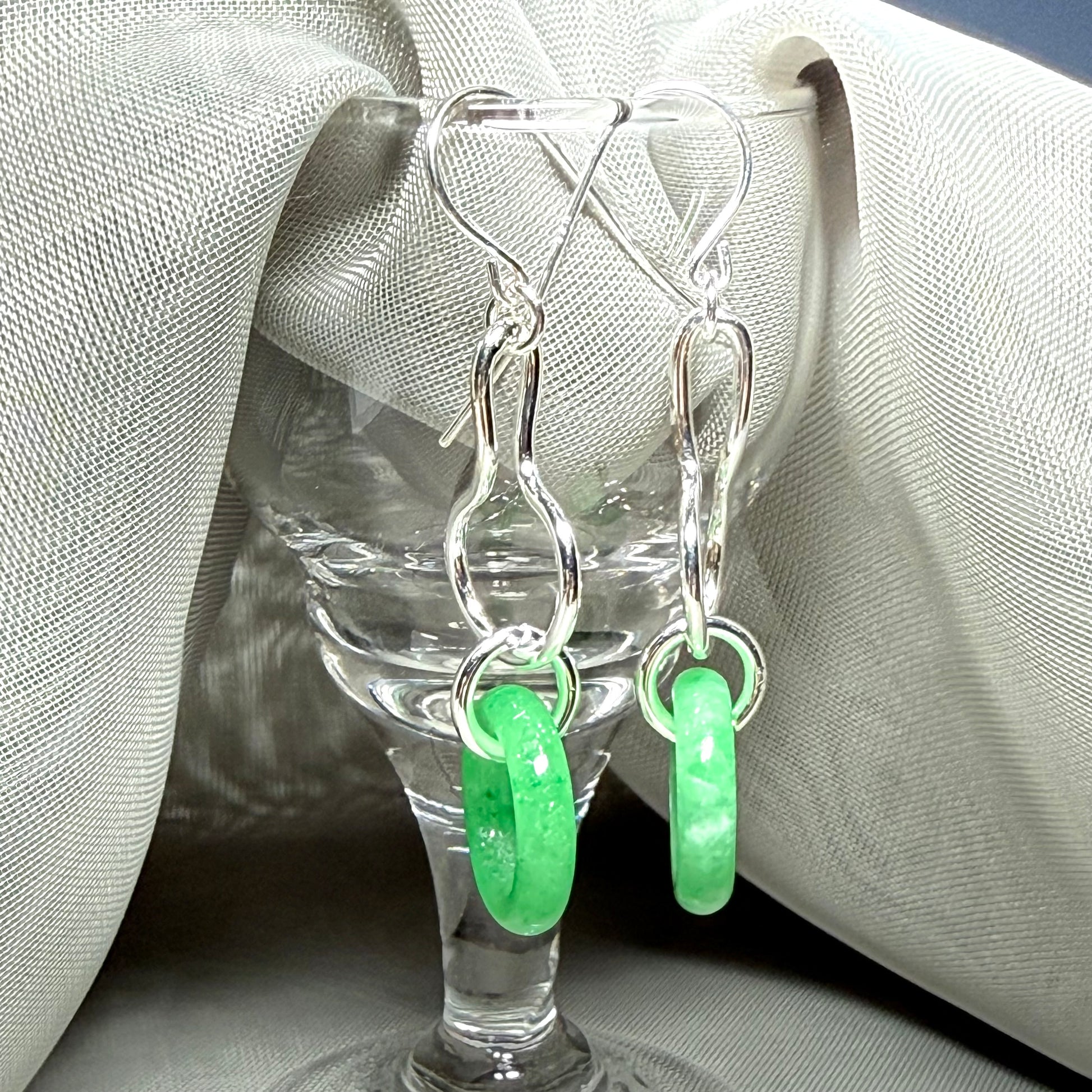A rounded shaped real green jade sterling silver looped dangling dropped earrings
