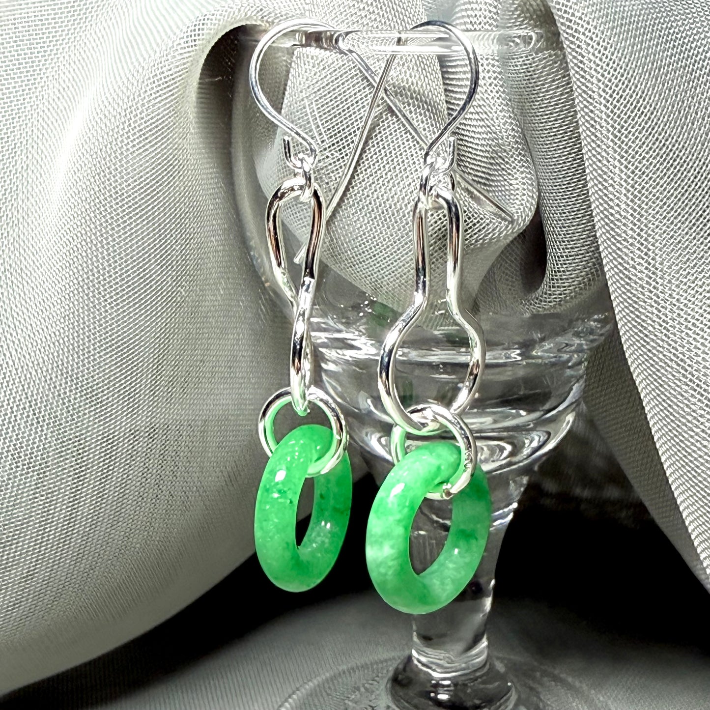 A rounded shaped real green jade sterling silver looped dangling dropped earrings