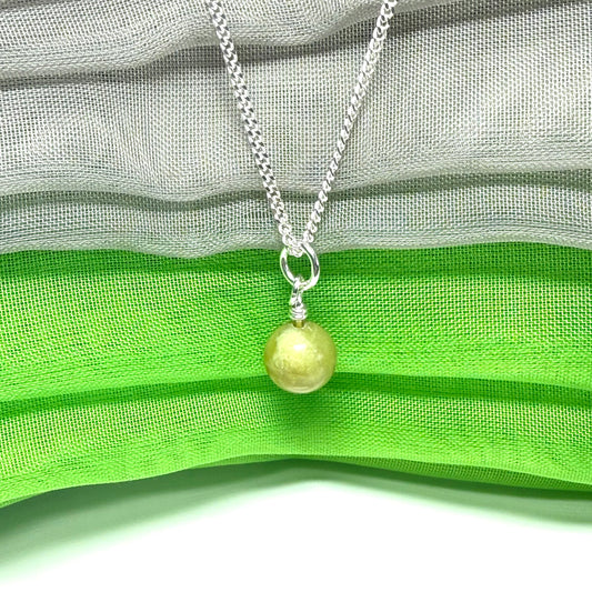 A small real green gypsum necklace ball shaped, a gorgeous pendant