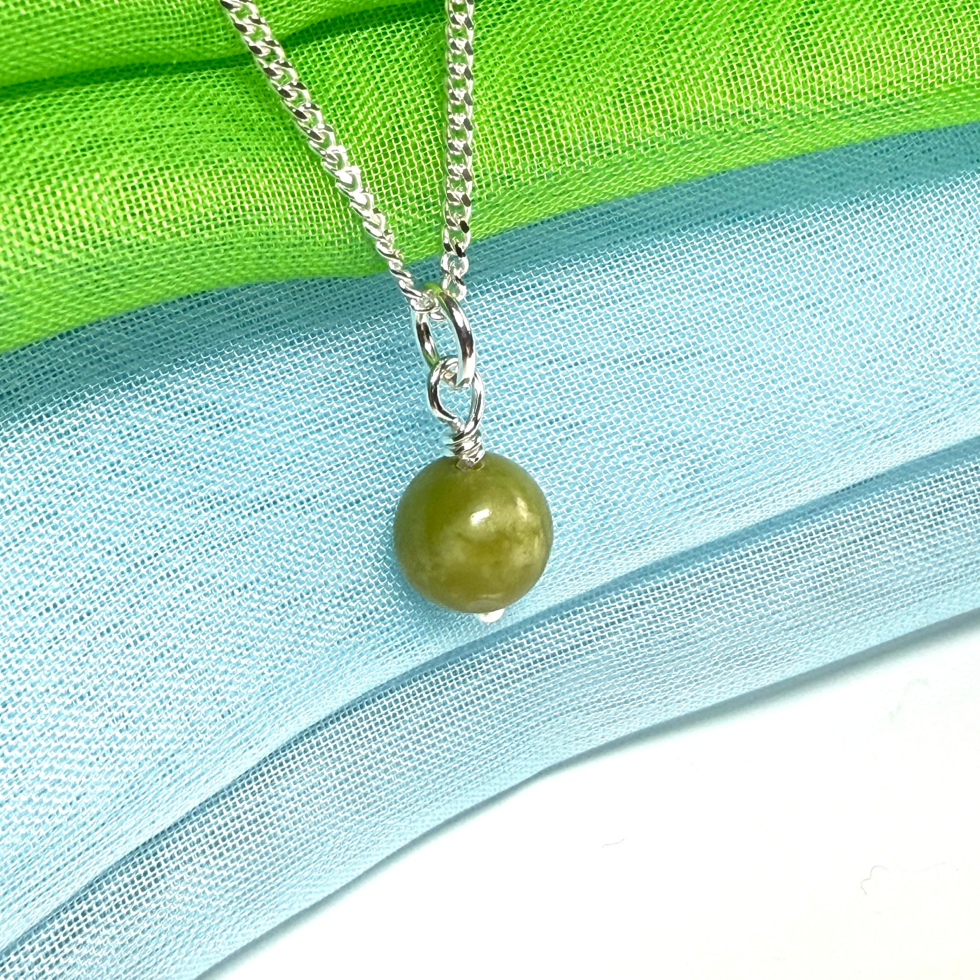 A small real green gypsum necklace ball shaped, a really gorgeous round pendant