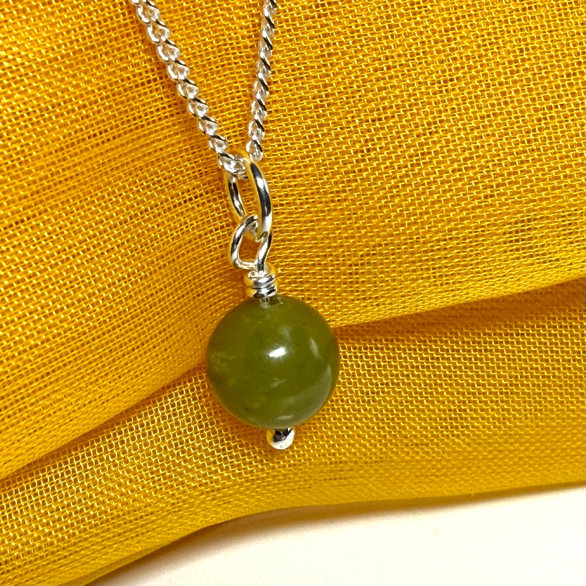 Small round real green gypsum necklace ball shape pendant with chain measuring 8.5 mm diameter