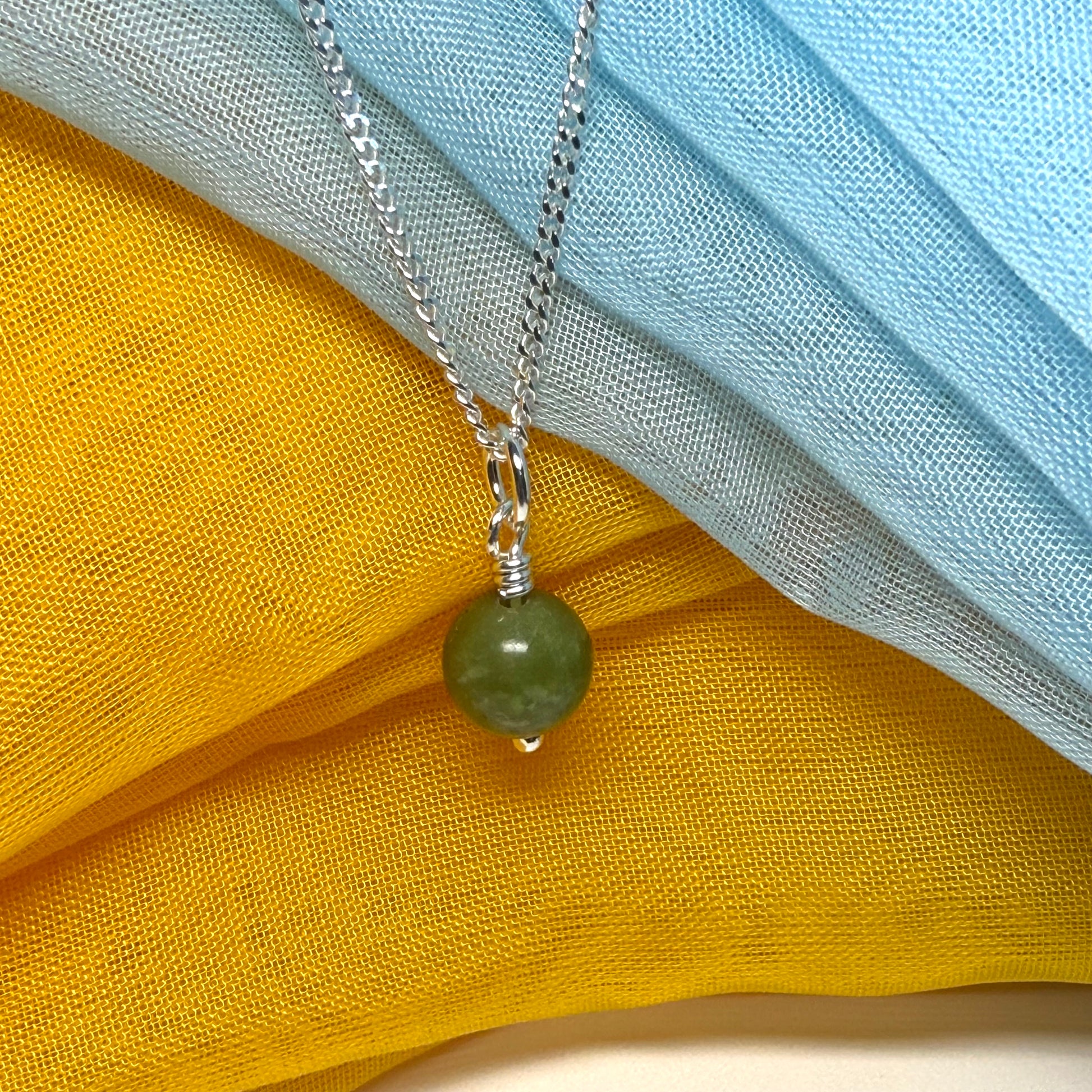 Small round real green gypsum necklace ball shape pendant with chain measuring 8.5 mm in diameter
