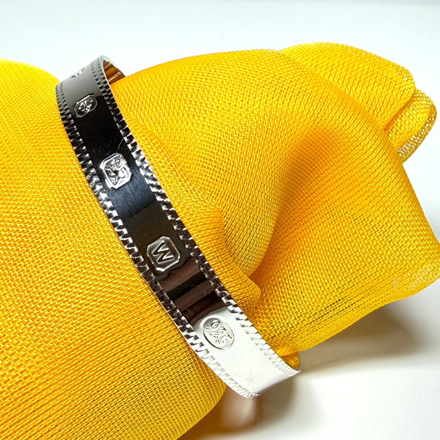 A child's small expanding bangle Hallmark feature designed sterling silver