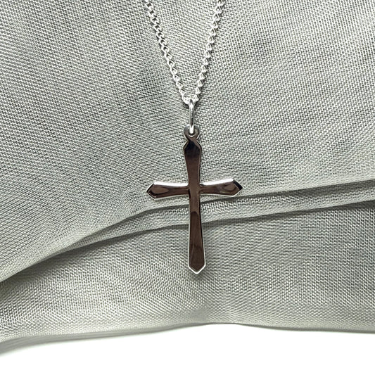 A solid sterling silver cross necklace fancy shaped pendant with a chain