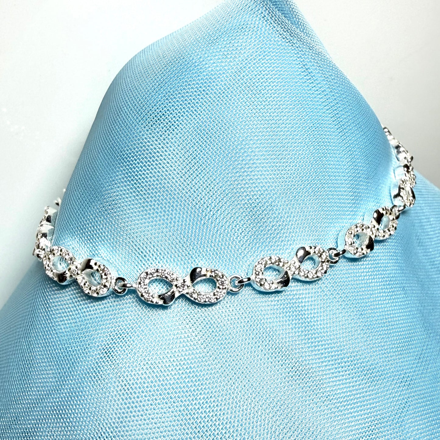 Sparkling infinity style shaped cubic zirconia sterling silver bracelet