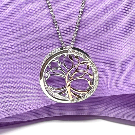 A sterling silver solid round open pierced fancy swirl Tree of Life necklace