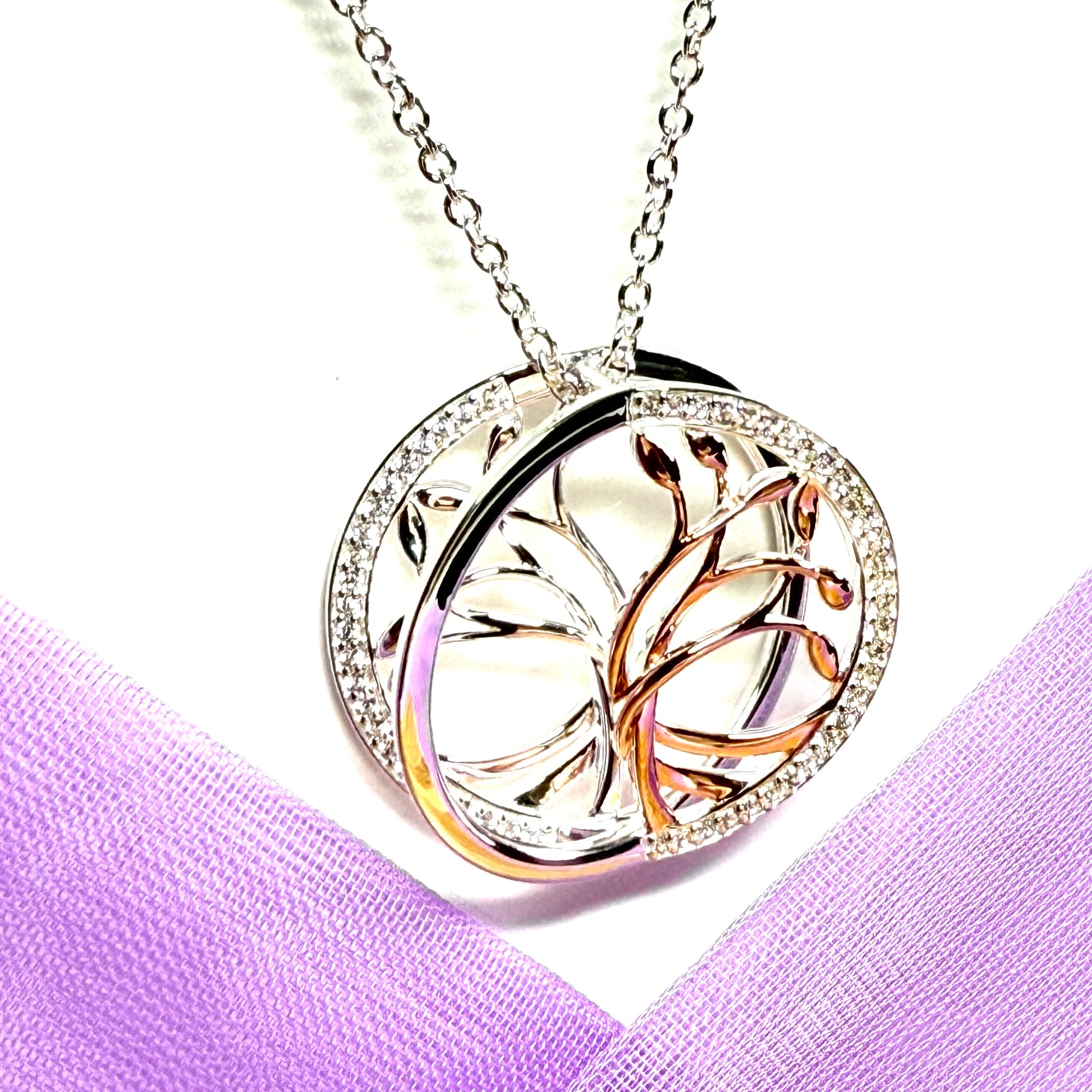 A sterling silver solid round open pierced fancy swirl Tree of Life necklace with a chain