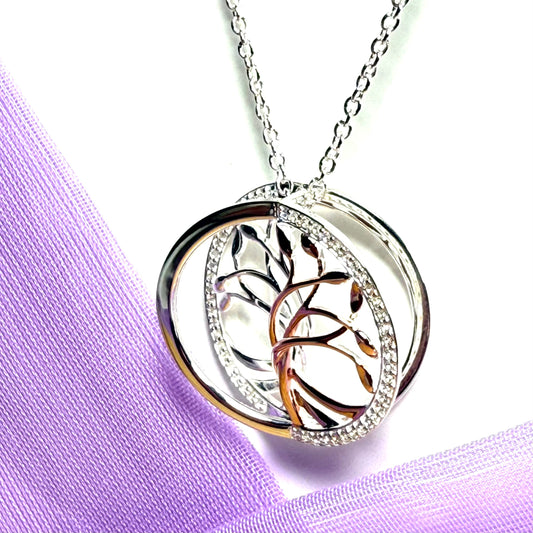 A sterling silver solid round open pierced fancy swirl Tree of Life necklace