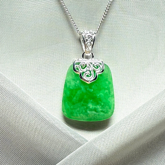 A beautiful and stunning real green jade necklace large pendant that is cushion shape