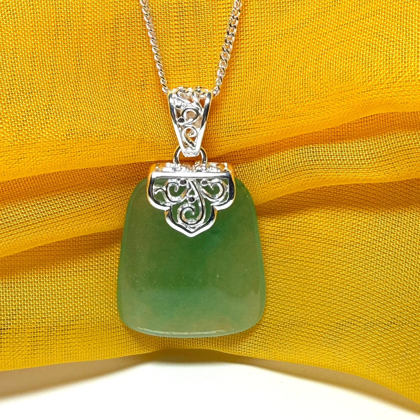 Beautiful and timeless real green jade necklace large pendant that is cushion shaped