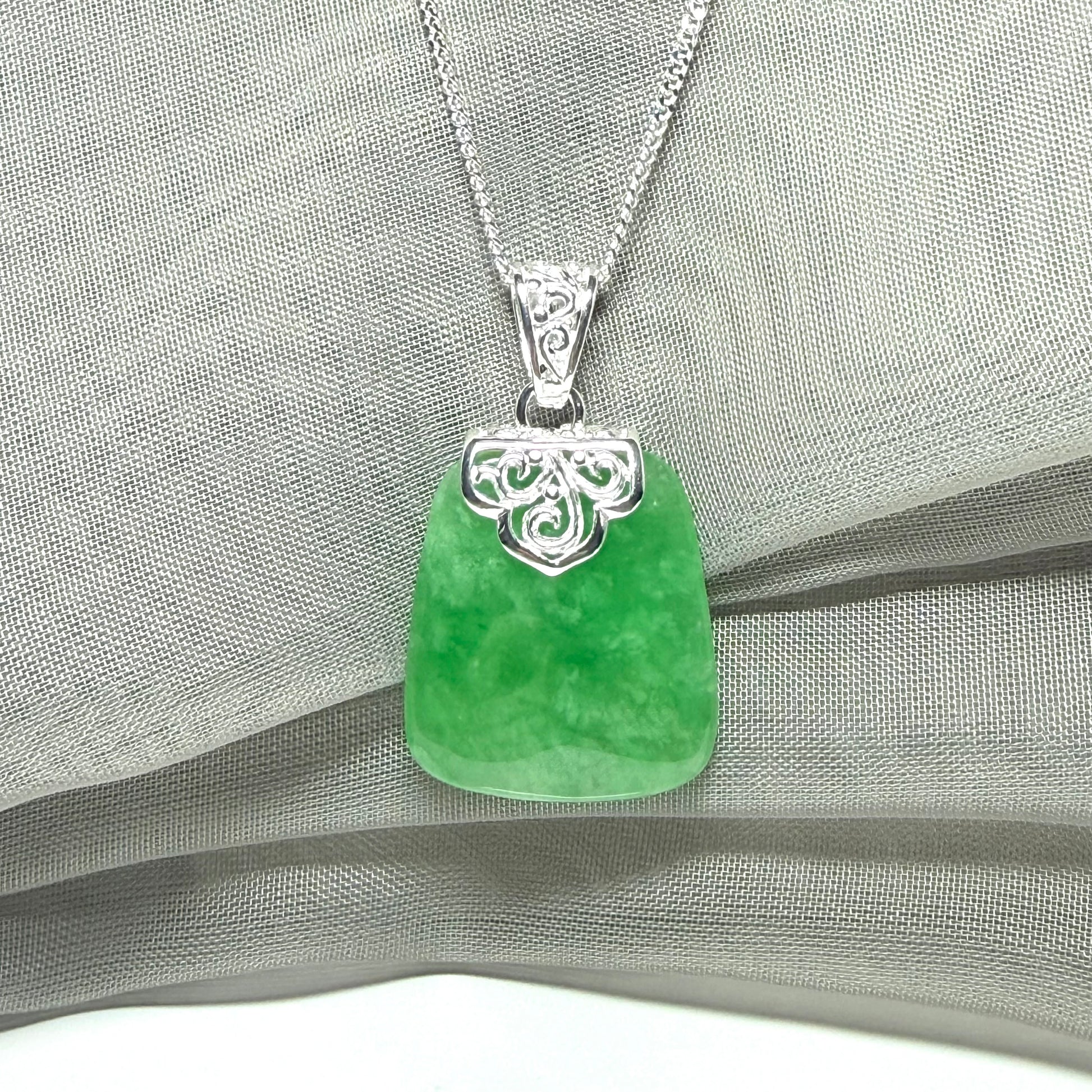 A beautiful and stunning real green jade necklace large pendant that is cushion shape