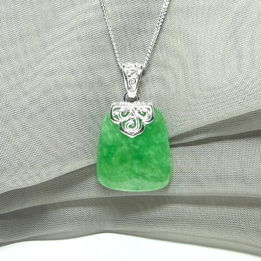 A beautiful and stunning real green jade necklace large pendant that is cushion shape