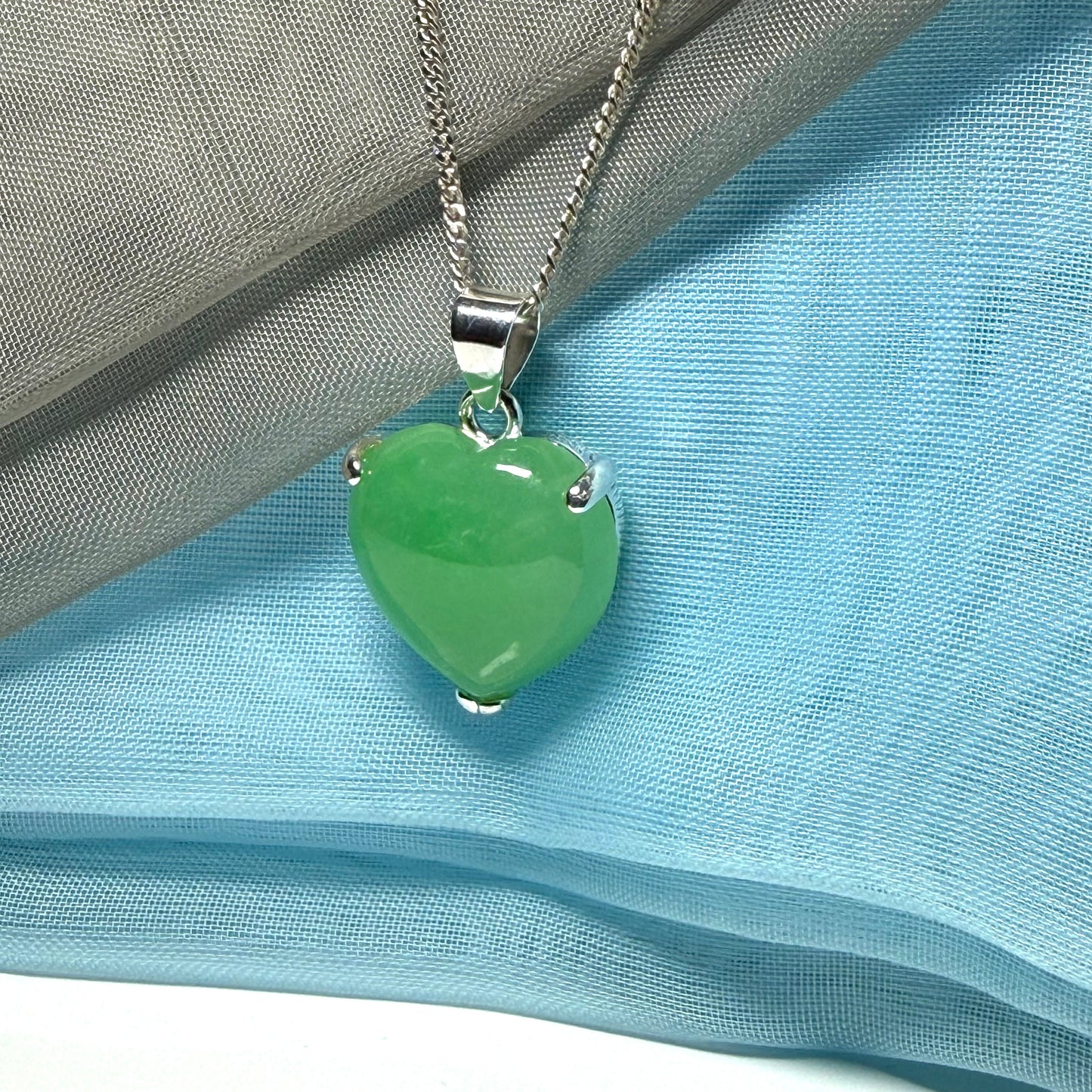 A real green jade necklace heart shaped sterling silver with chain